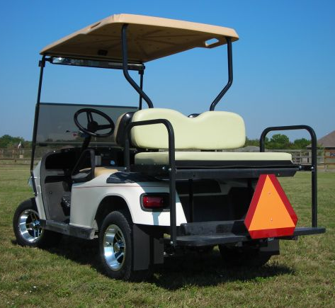 White Golf Cart with caution triangle on the rear