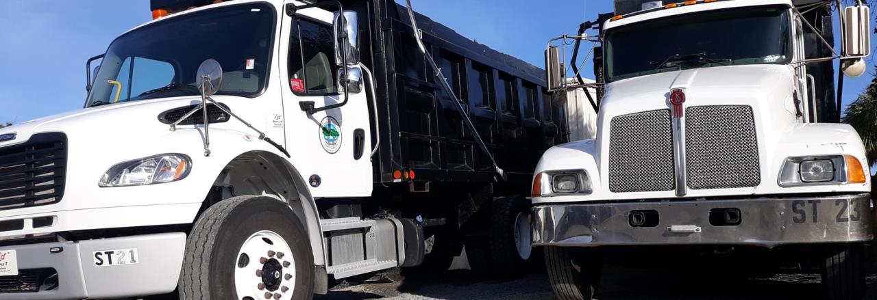 Website Banner showing two dump trucks