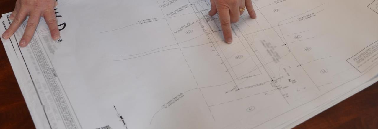 Development Services Website Banner showing construction schematics