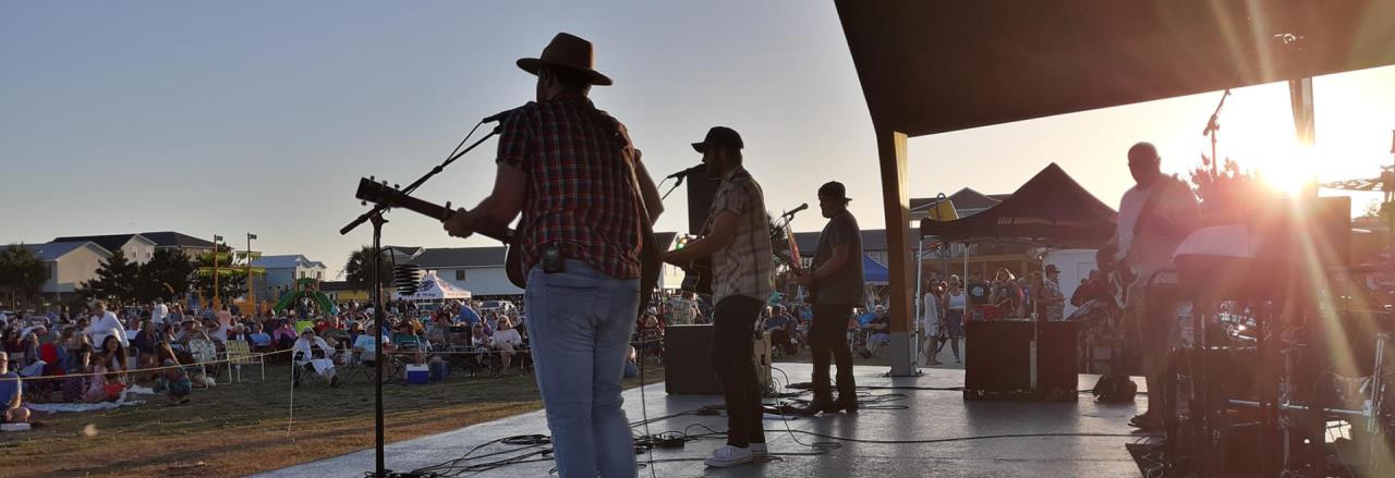 backstage view of band during a summer concert